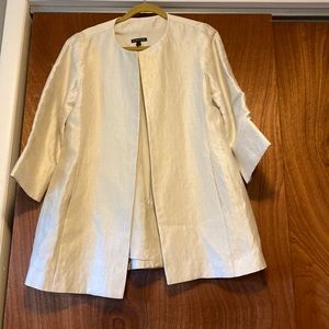 Like new jacket. Color is a cream with a touch of gold.